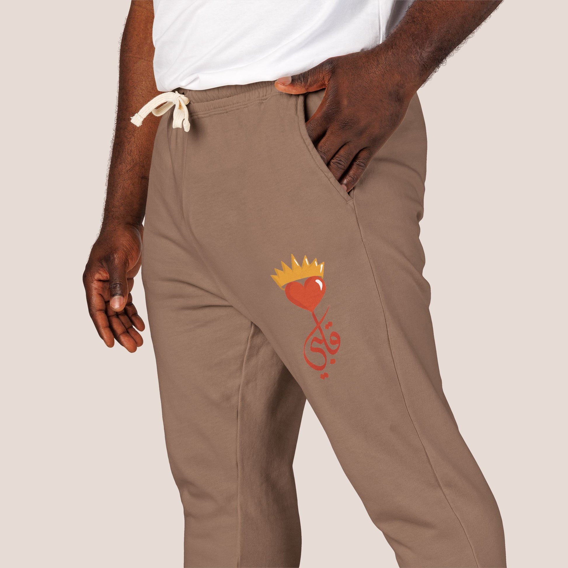 Brown pants with a red and gold design on a beige background