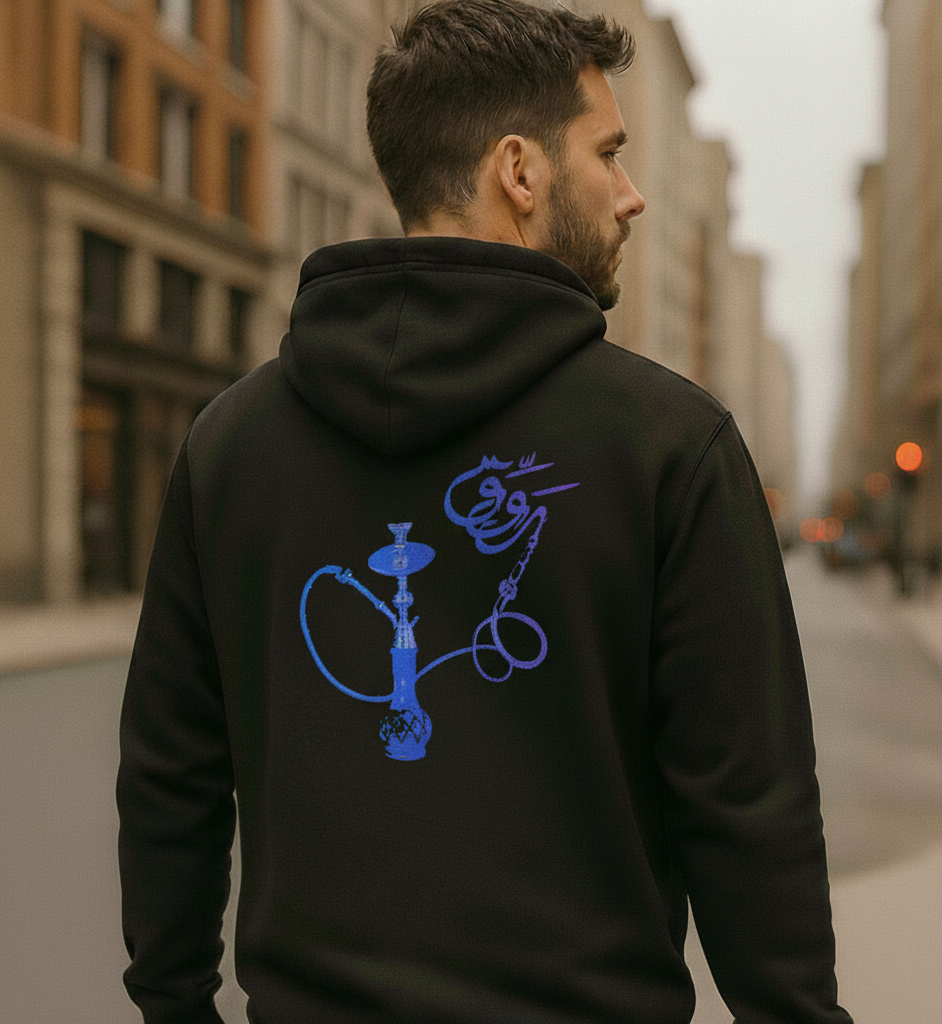 Man wearing a black hoodie with blue hookah design on the back, walking down a city street.